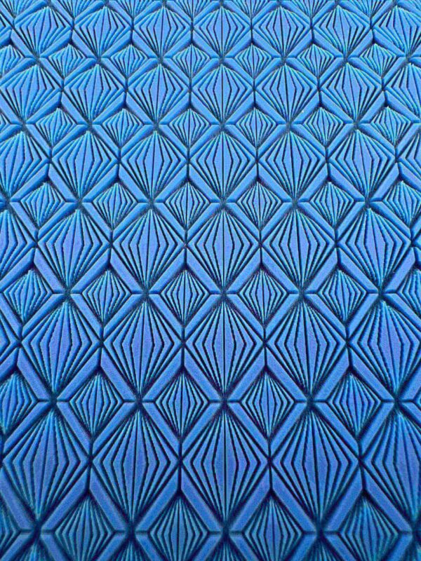 Blue geometric pattern with symmetrical diamond shapes.