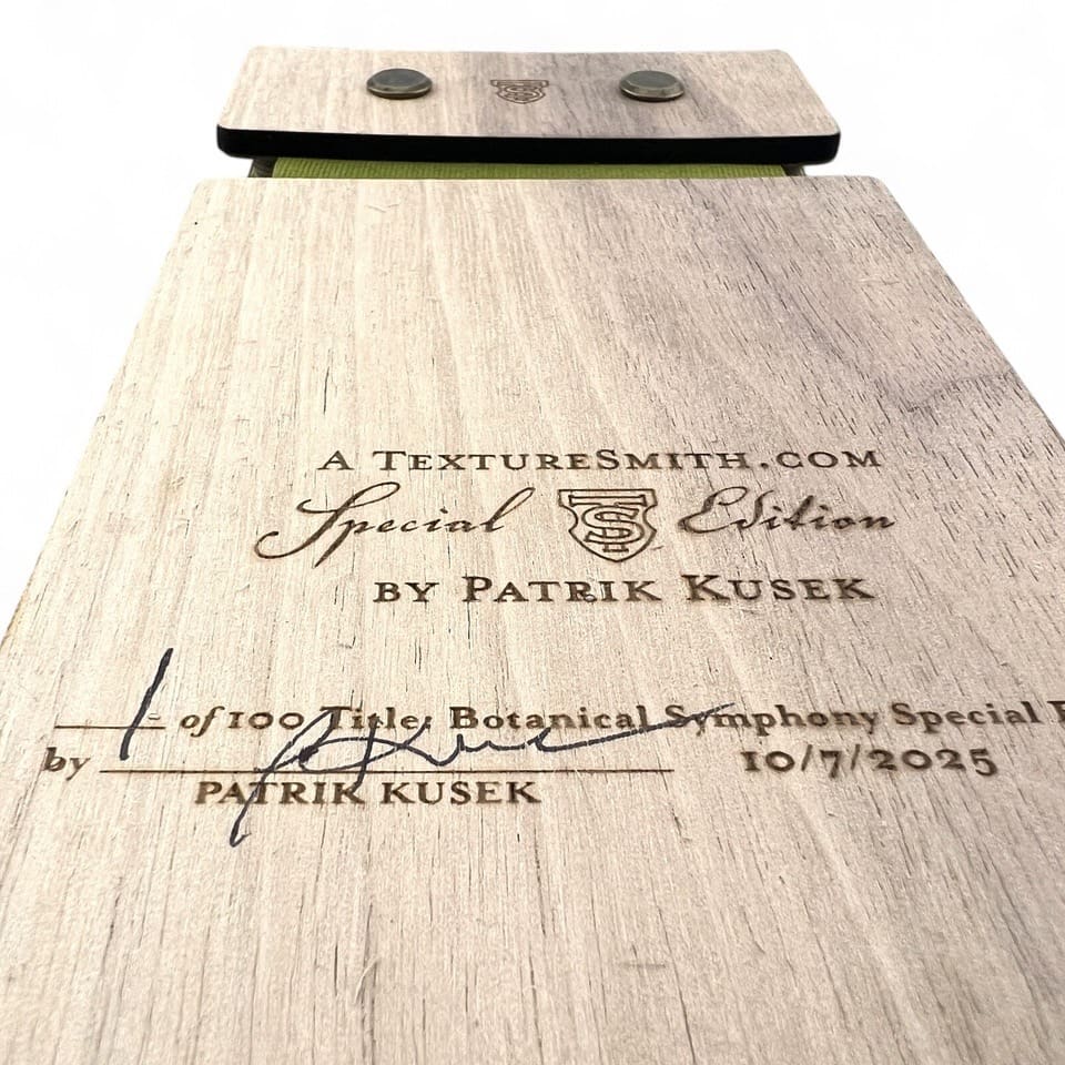 Close-up of a signed and dated book page with a dedication.