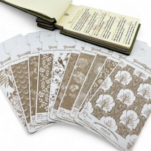 Set of artistic stencils and a sketchbook for creative projects.