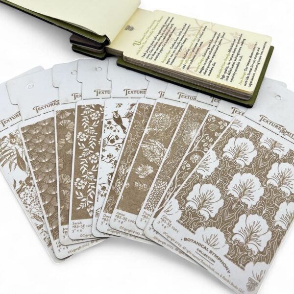 Set of artistic stencils and a sketchbook for creative projects.