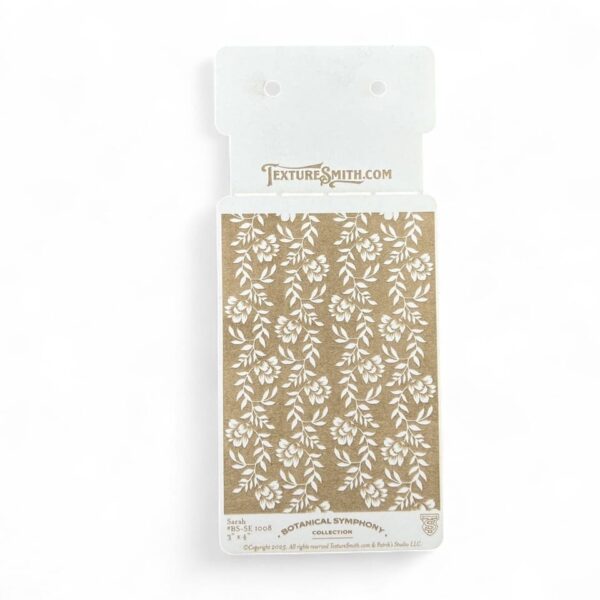 Brown and white floral patterned gift wrap sheet in clear packaging.