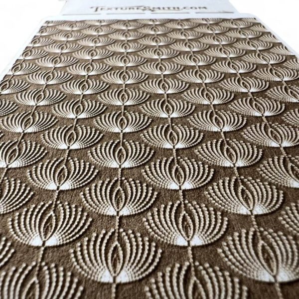 Intricate textured pattern with concentric circles and fan shapes.