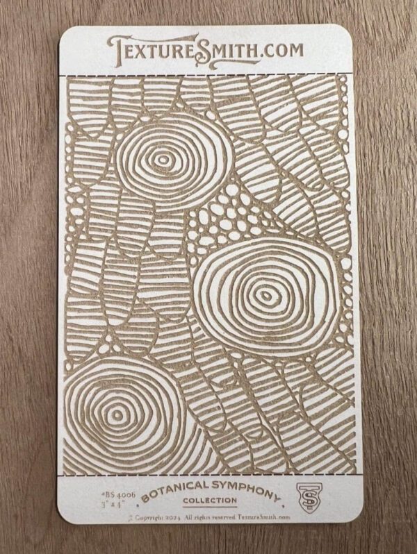 Abstract artwork with concentric circles and textured patterns in gold on white.