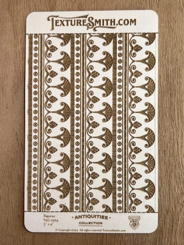 Decorative fabric with symmetrical brown floral patterns on a beige background.