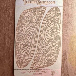 Vintage coffee bean illustration on textured card.