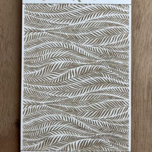 Decorative fabric with a wavy leaf pattern in neutral tones.