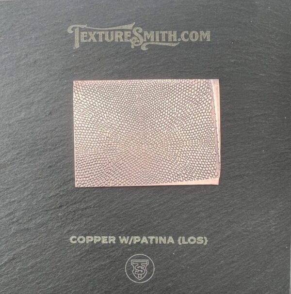 Copper sheet with a patina texture on a black background.