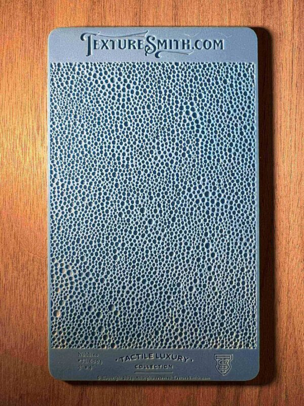 Blue textured notebook on a wooden surface.