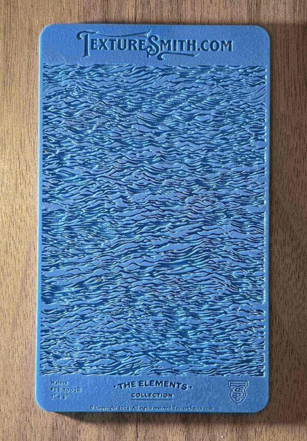 Close-up of a textured blue surface with a wood grain pattern.