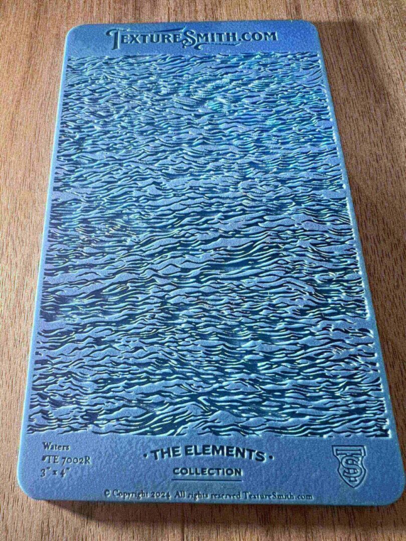 A blue book titled 'The Elements' with a textured cover.
