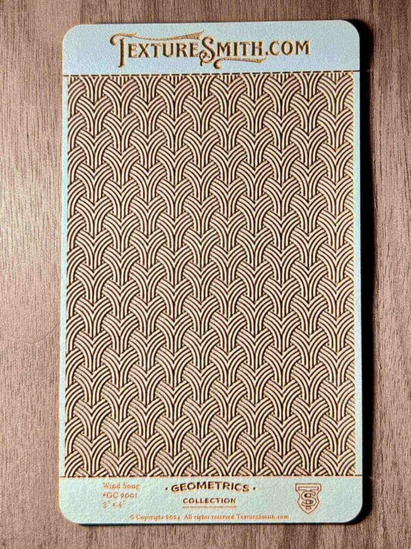Textured beige fabric with a repeating scallop pattern.