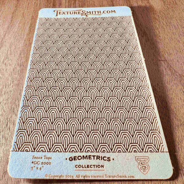 A textured fabric sample with geometric patterns labeled 'Geometries' collection.