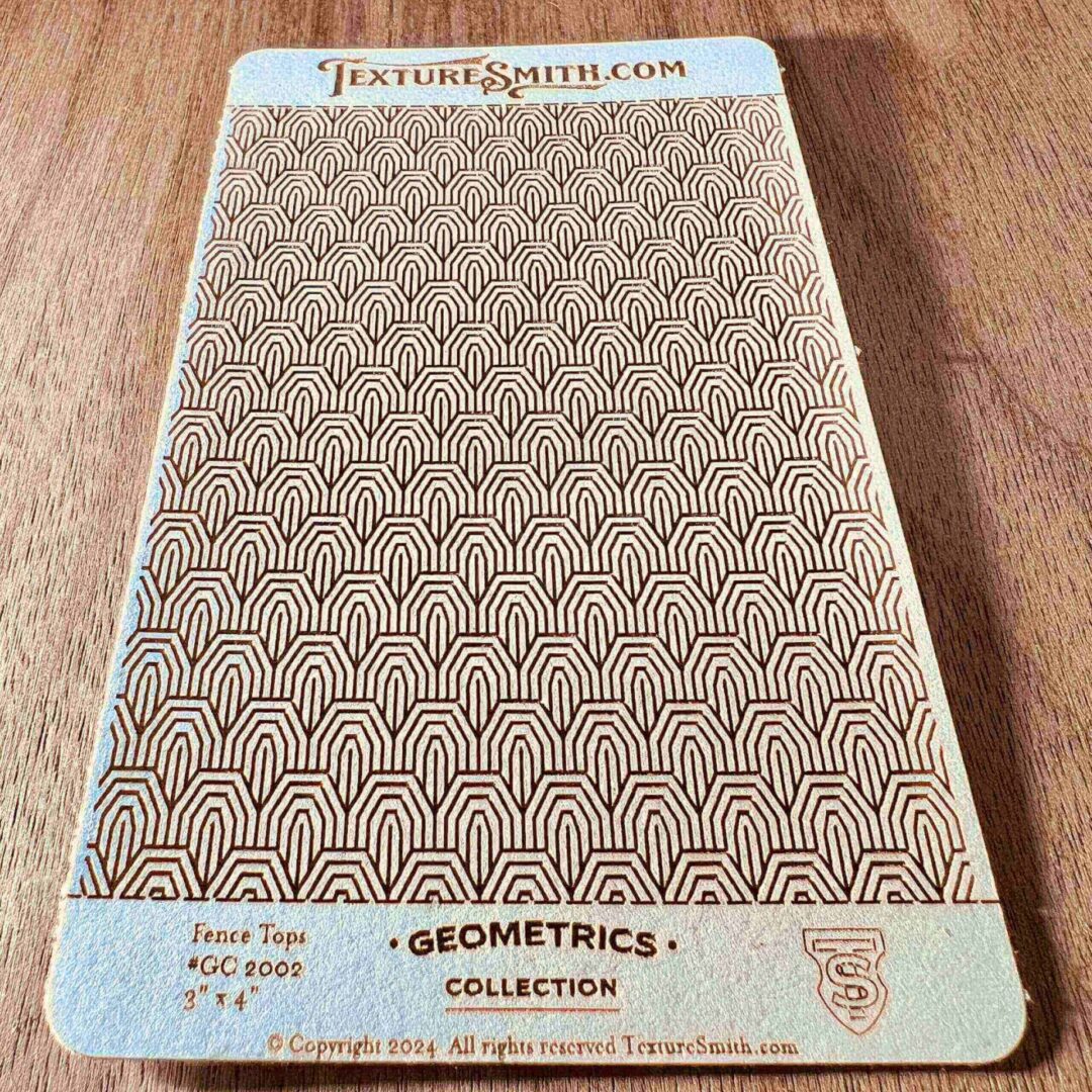 A textured fabric sample with geometric patterns labeled 'Geometries' collection.