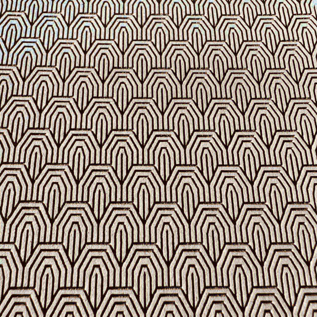 Geometric pattern with repeating arch shapes in black and beige.
