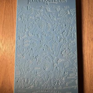 Close-up of a textured blue surface with embossed text.