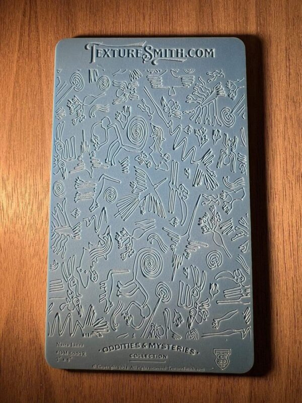 Close-up of a textured blue surface with embossed text.