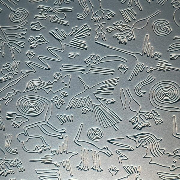 Intricate petroglyphs etched into stone surface.