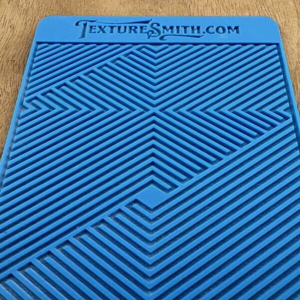 Blue card with intricate geometric patterns and the text 'TextureSmith.com'.