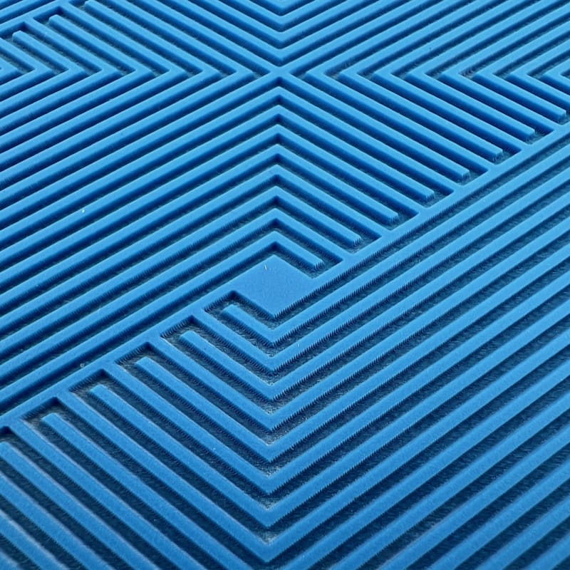 Blue geometric pattern with intersecting lines and shapes.