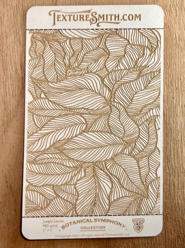 Intricate leaf pattern etched on wooden surface.