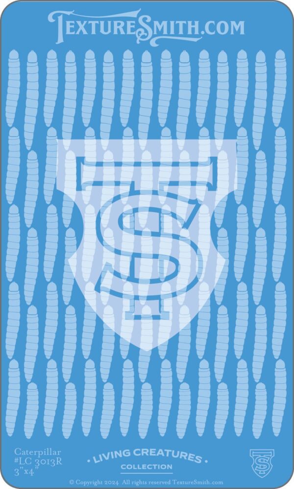 Blue fabric with a shield and 'S' emblem pattern.
