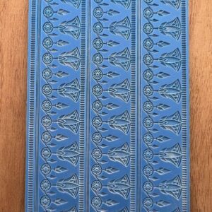 Blue decorative book cover with intricate embossed patterns.