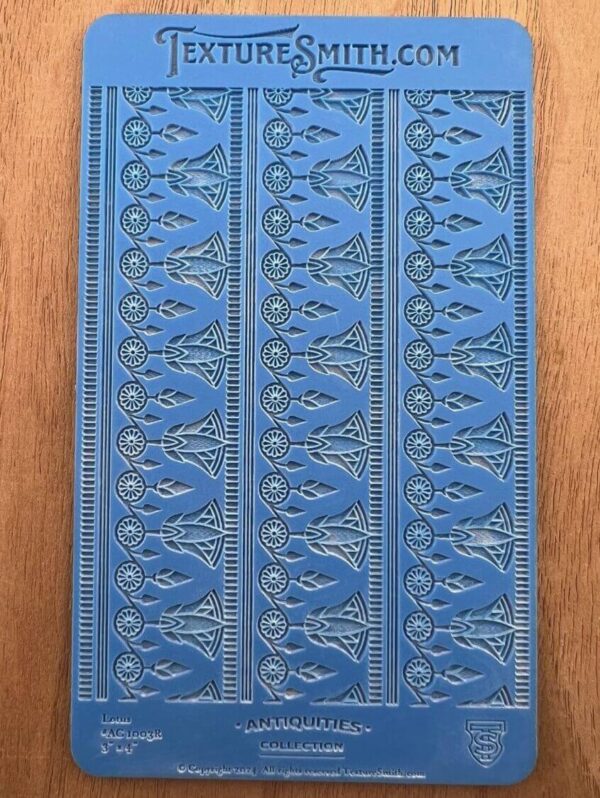 Blue decorative book cover with intricate embossed patterns.