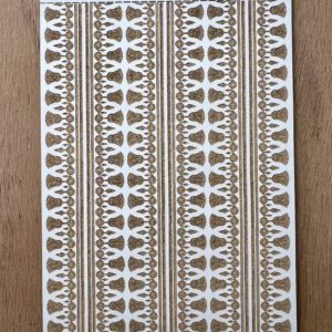 Intricate brown and white patterned fabric with geometric designs.