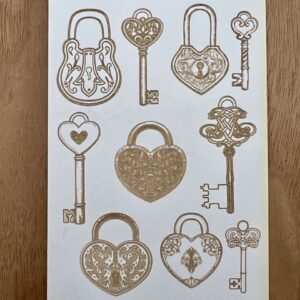 Decorative vintage keys and heart-shaped locks set on a wooden surface.