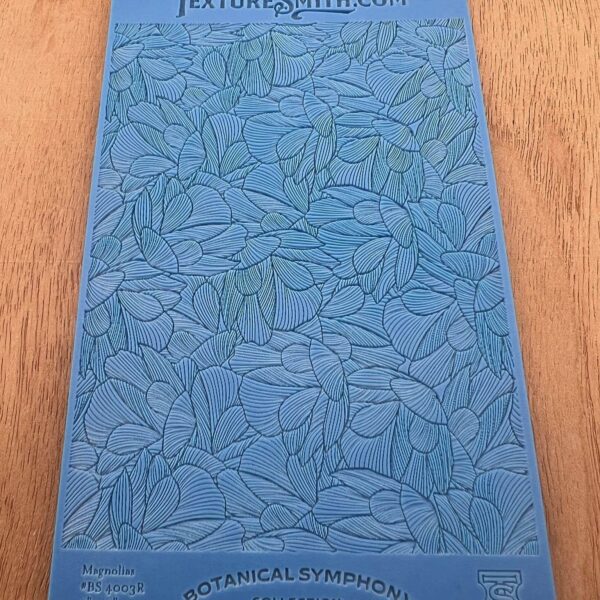 Blue book cover with leaf pattern and title.