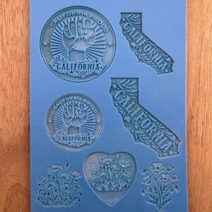 Silicone mold with California-themed designs including state shape and seals.