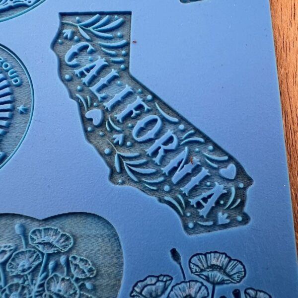A silicone mold shaped like California with the word 'California' embossed.