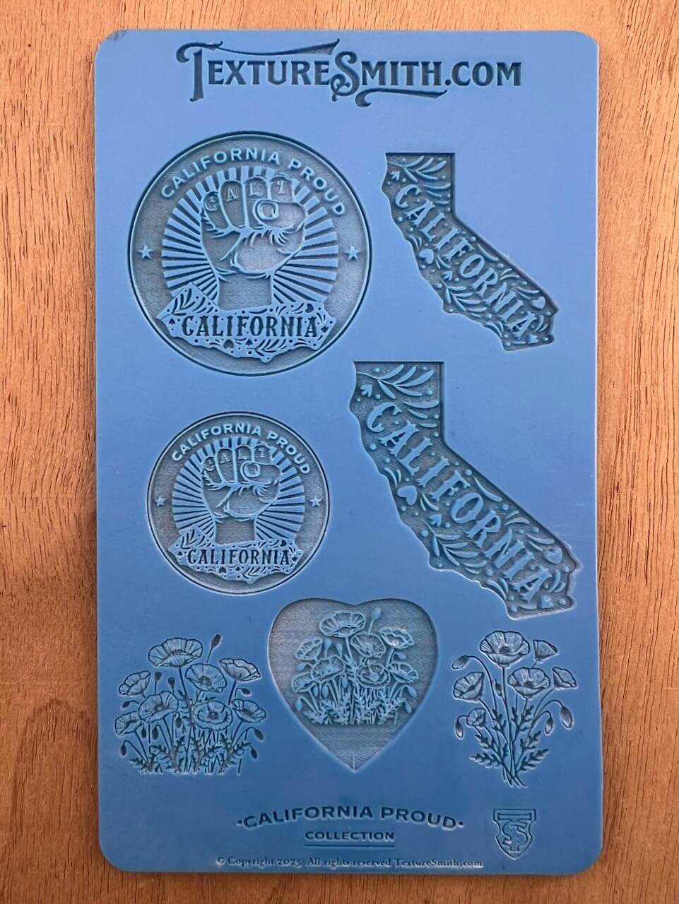 Silicone mold with California-themed designs including state shape and seals.