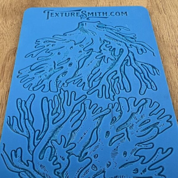 Blue sheet with black handprint outlines and a website URL.