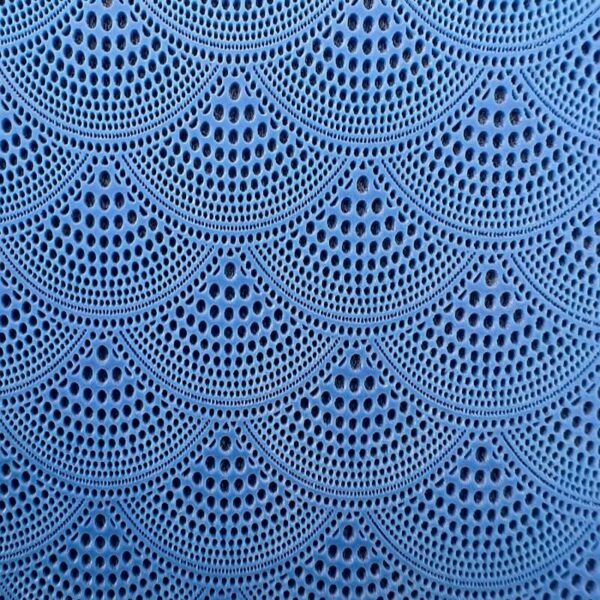 Blue crochet pattern with repeating semi-circles and intricate details.