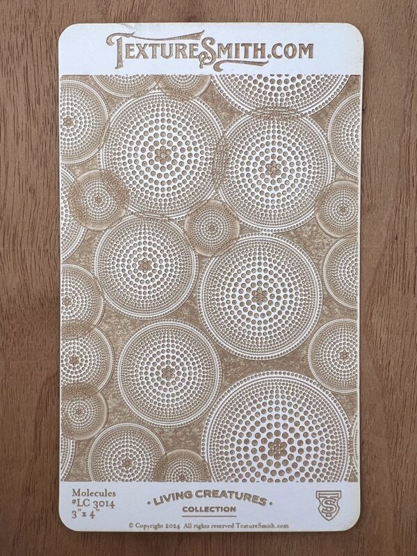 Textured wall panel with circular, geometric patterns in neutral tones.