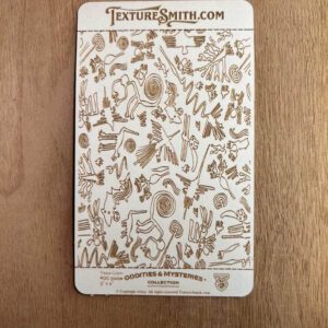 A card with illustrated insects and arachnids on a wooden surface.