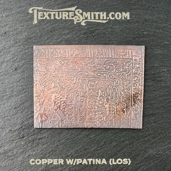 Copper panel with natural patina and textured surface on a dark background.