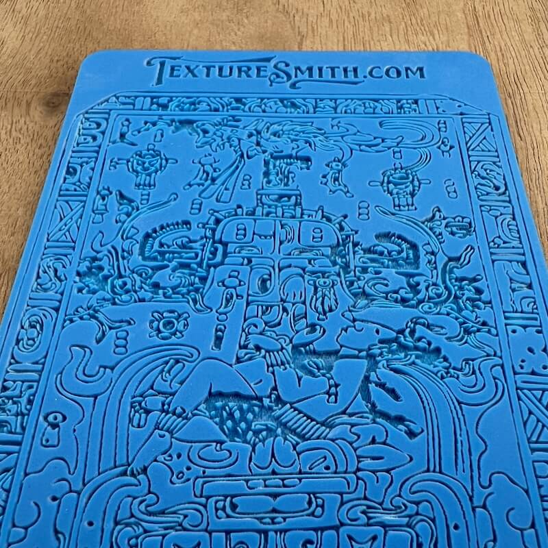 Blue book cover with intricate doodle art and text at the top.