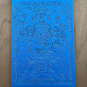 Intricate blue embossed artwork with various detailed figures and patterns.