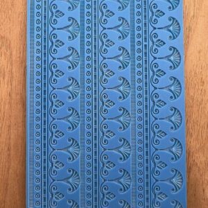 Blue book cover with intricate embossed floral patterns.