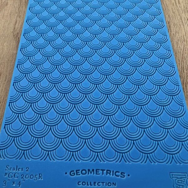 Blue textured mat with geometric patterns and label.