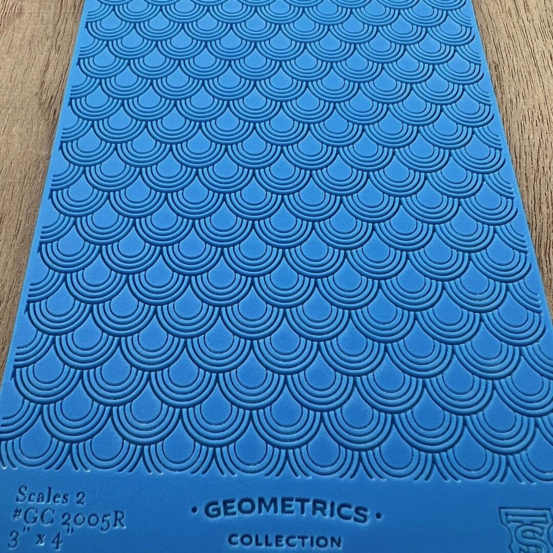Blue textured mat with geometric patterns and label.