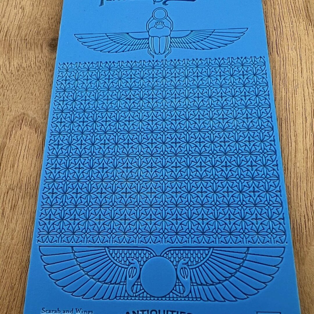 Blue board with Egyptian symbols and a word search puzzle.