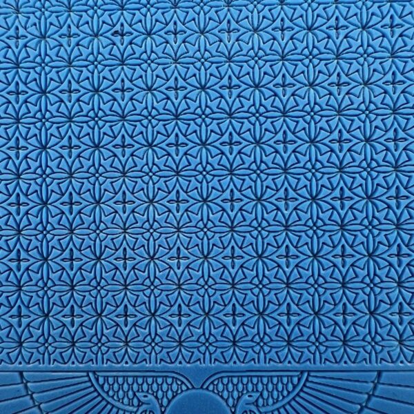 Blue fabric with intricate geometric and floral patterns.