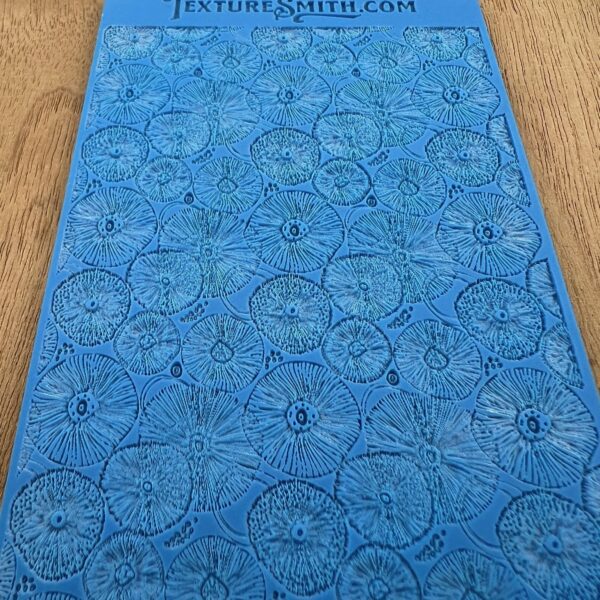 Blue notebook with intricate circular patterns on the cover.