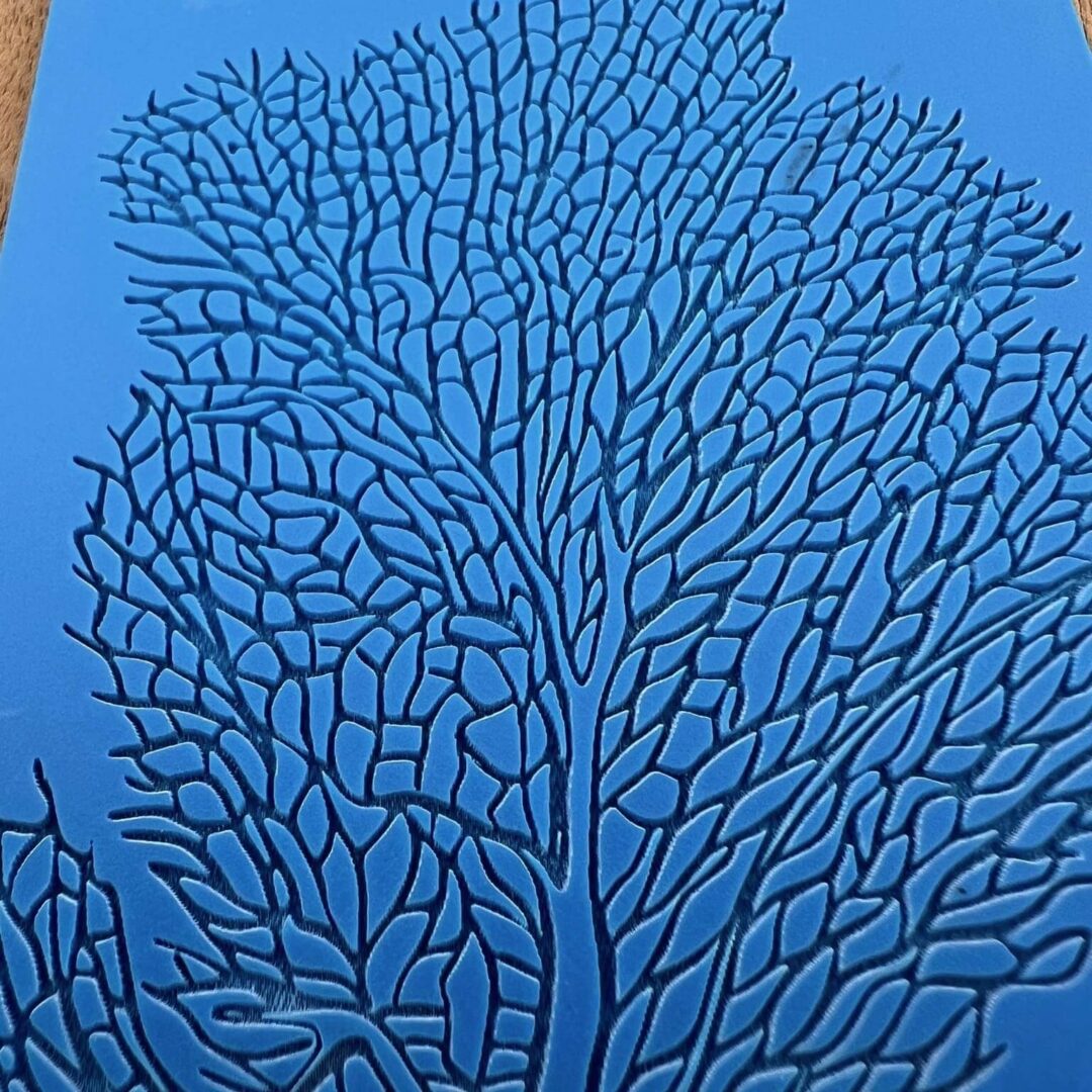 Intricate blue coral pattern resembling a tree structure.