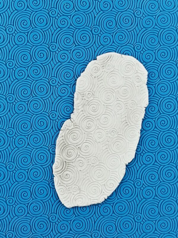 White shape on textured blue spiral design
