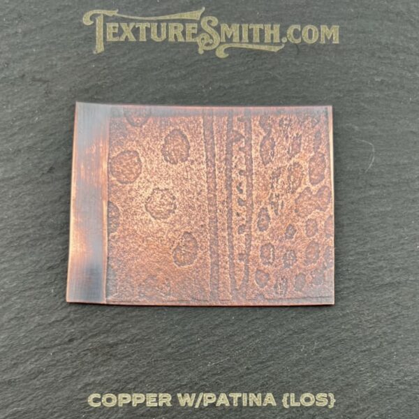 Copper sheet with natural patina and oxidation marks.