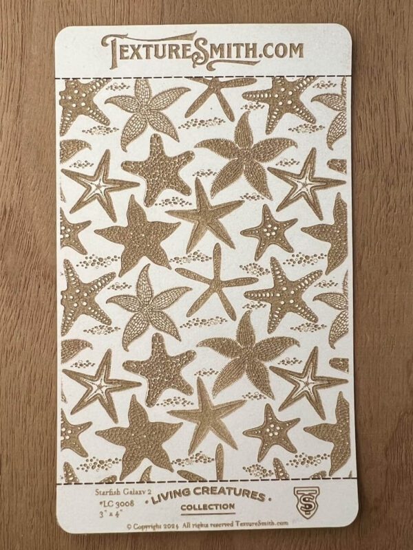 Decorative fabric with starfish pattern in shades of brown and beige.